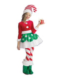 Girl in candy cane elf tutu dress with green spotted skirt, striped leggings, hat and fur-trim boot covers