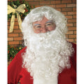 Man wearing a curly white Santa wig and full beard
